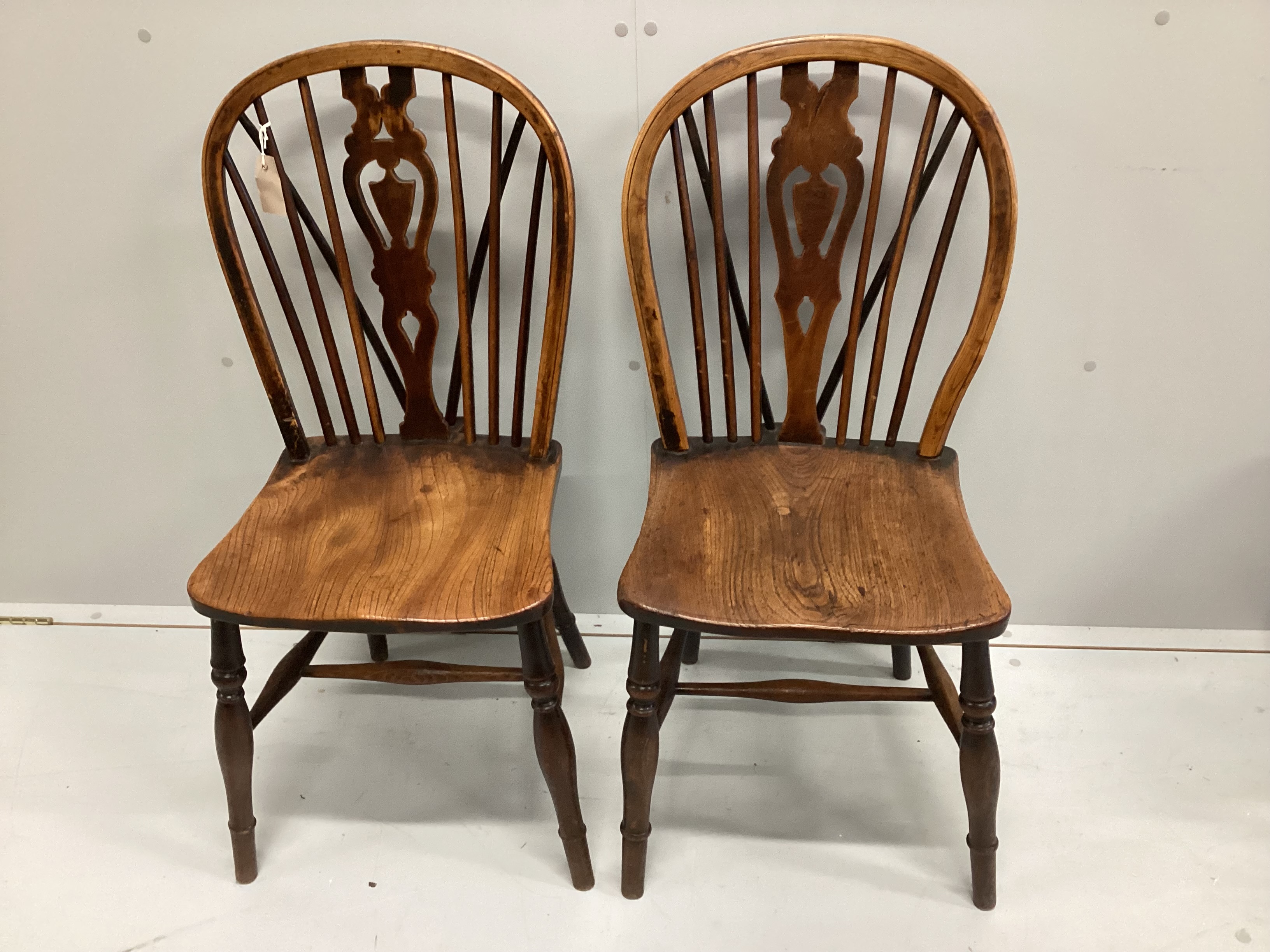 A harlequin set of four 19th century ash, elm and beech Windsor chairs